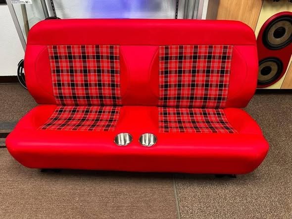 Classic bench seat done in red leather with plaid inserts