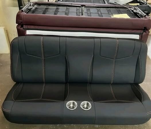 Distressed black ET with center bolsters, SS cups, and orange stitching